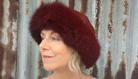 Woman wearing a Red Four Peaks Classic Panelled Lambskin & Possum Fur Hat.